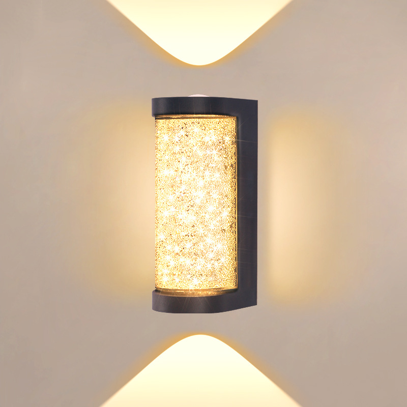 Square LED wall sconce with speckled amber glass cylinder and black frame, wall mounted