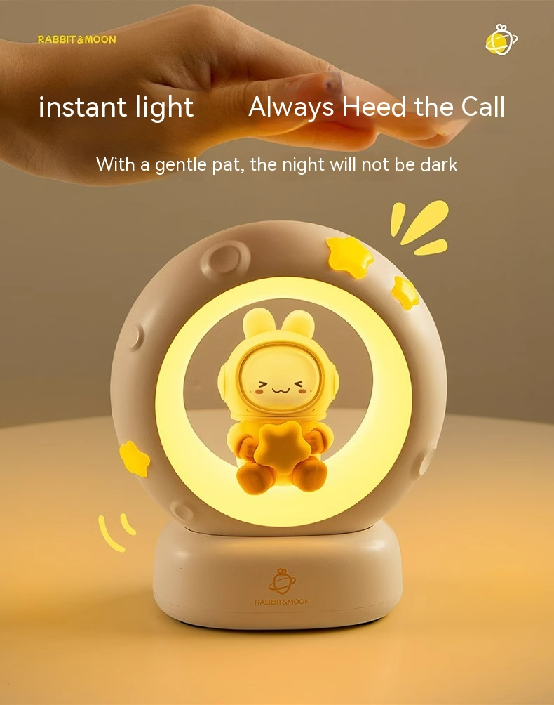 Beige bedside night light with glowing ring and yellow rabbit character in center