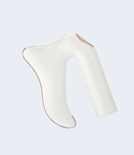 White gua sha massager head with U-shaped opening and gold trim