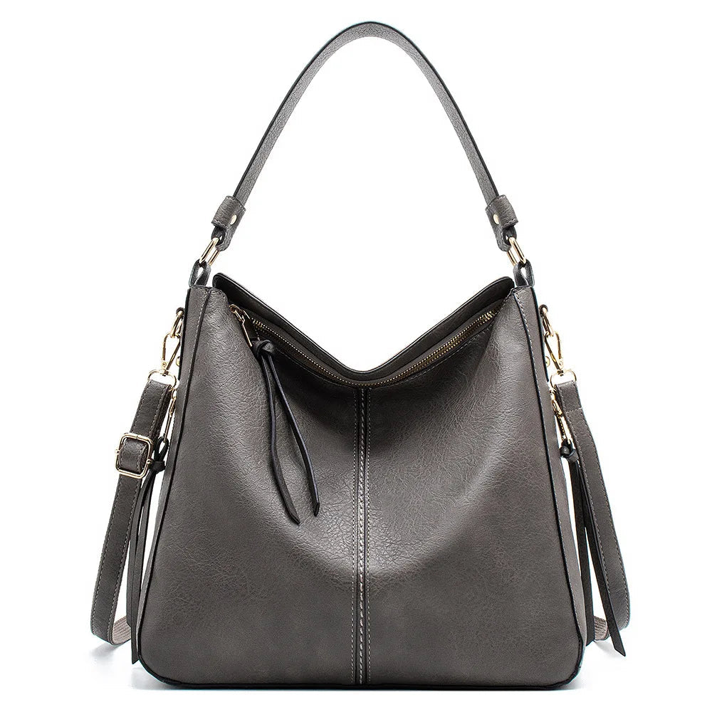 Gray PU leather hobo crossbody bag with top handles and side tassel straps