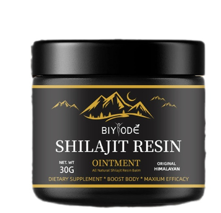 Shilajit resin ointment jar close-up, black container with gold front label