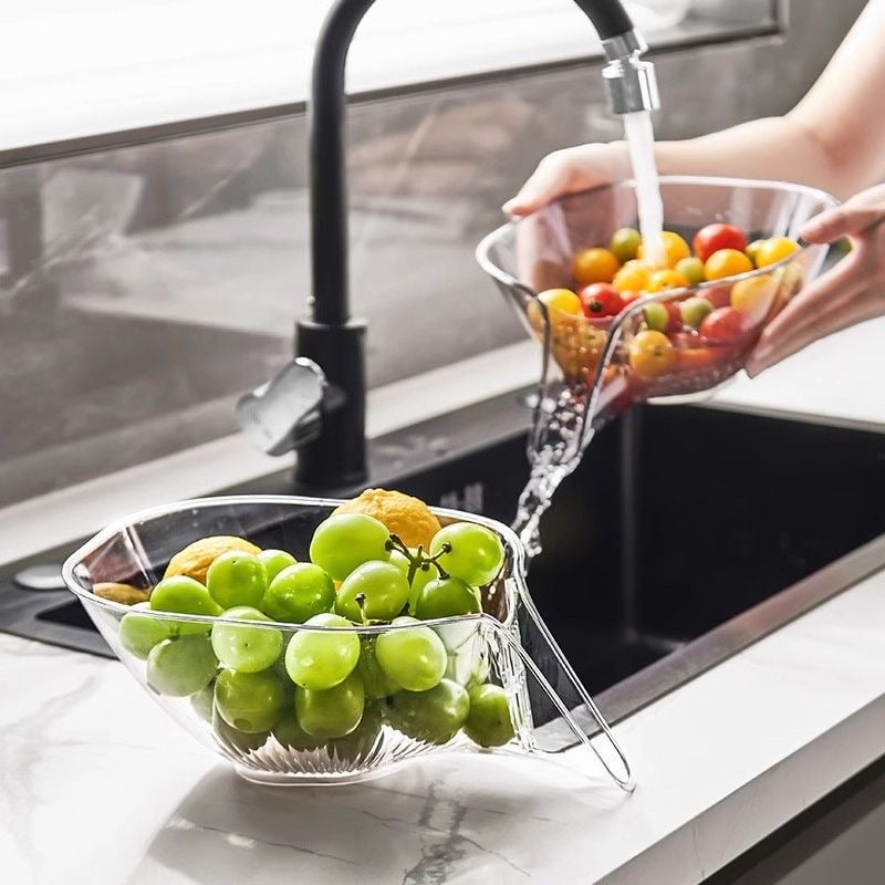 Kitchen drainage colander basket holding mixed vegetables while water drains, clear PCTG
