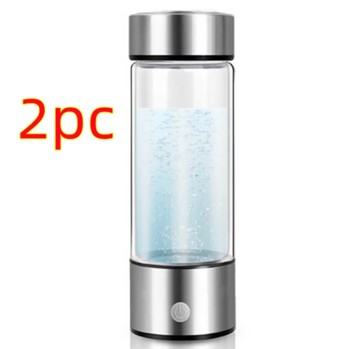 Hydrogen water bottle with silver metal top, clear glass body, and metal base