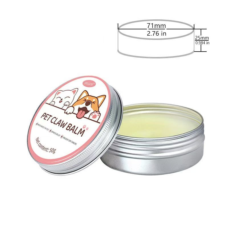 Pet paw balm cream in a round metal tin with open lid, showing pale yellow balm