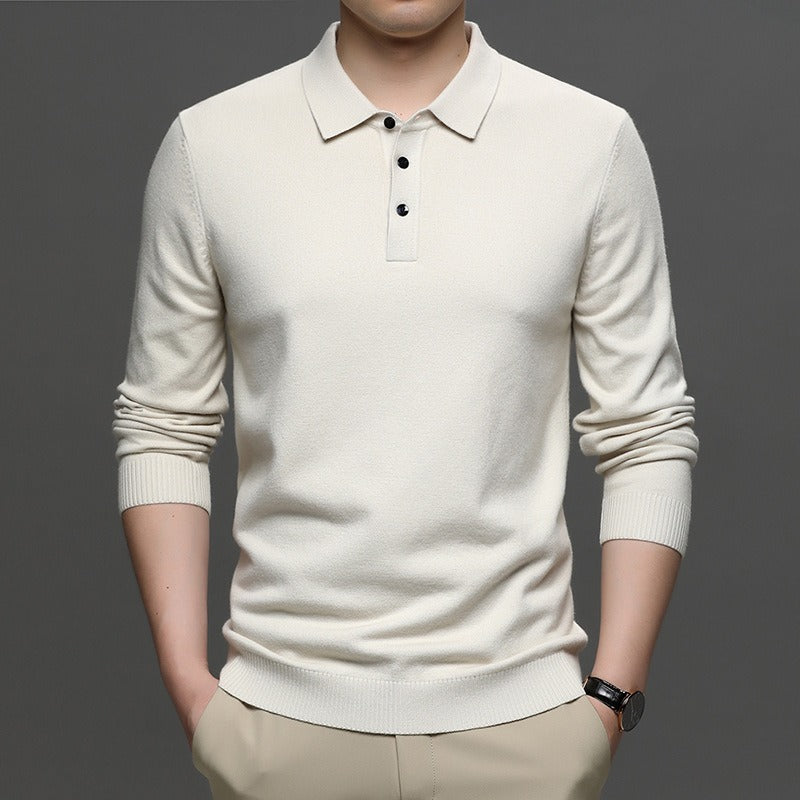 Cream knit polo sweater with lapel collar, button placket, ribbed cuffs and hem.