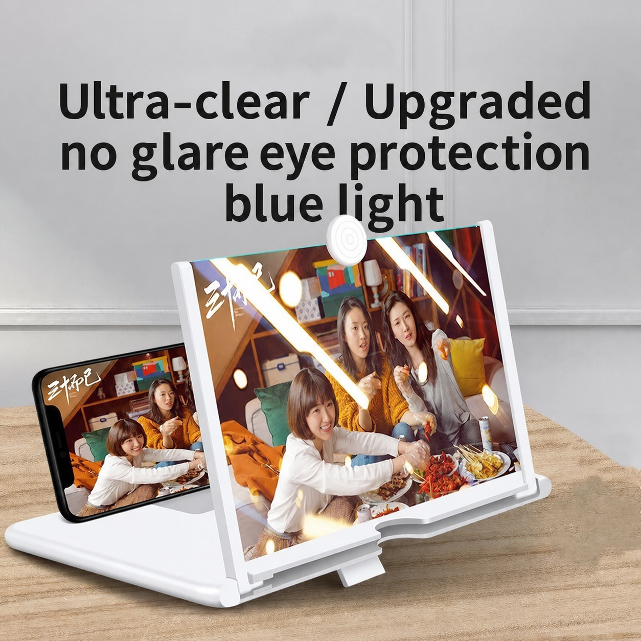 White pull-out phone screen magnifier stand with raised lens and multiple device views