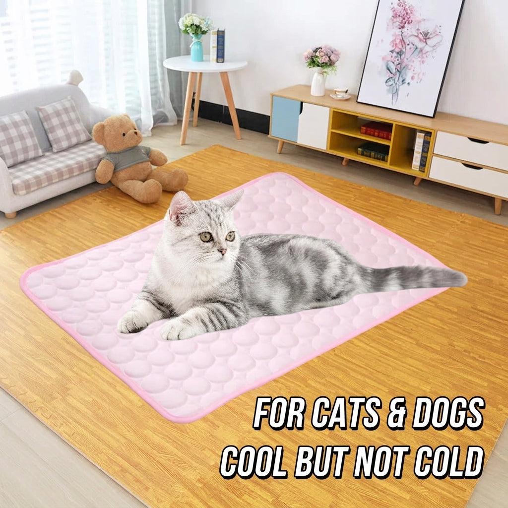 Pink ice silk cooling mat with raised pebble texture, featuring a resting cat