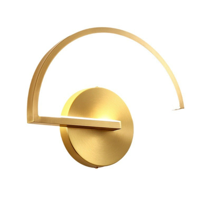 Gold LED wall lamp with circular backplate and arched light bar