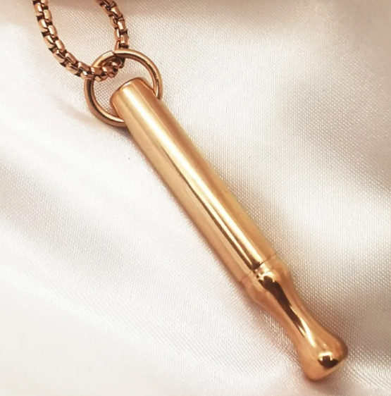 Rose-gold tone necklace with long cylindrical pendant on chain and open ring clasp