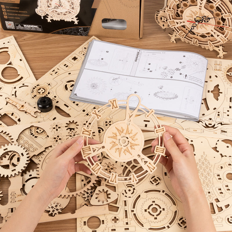 Wooden owl clock puzzle model in assembly with instruction sheet and laser-cut pieces