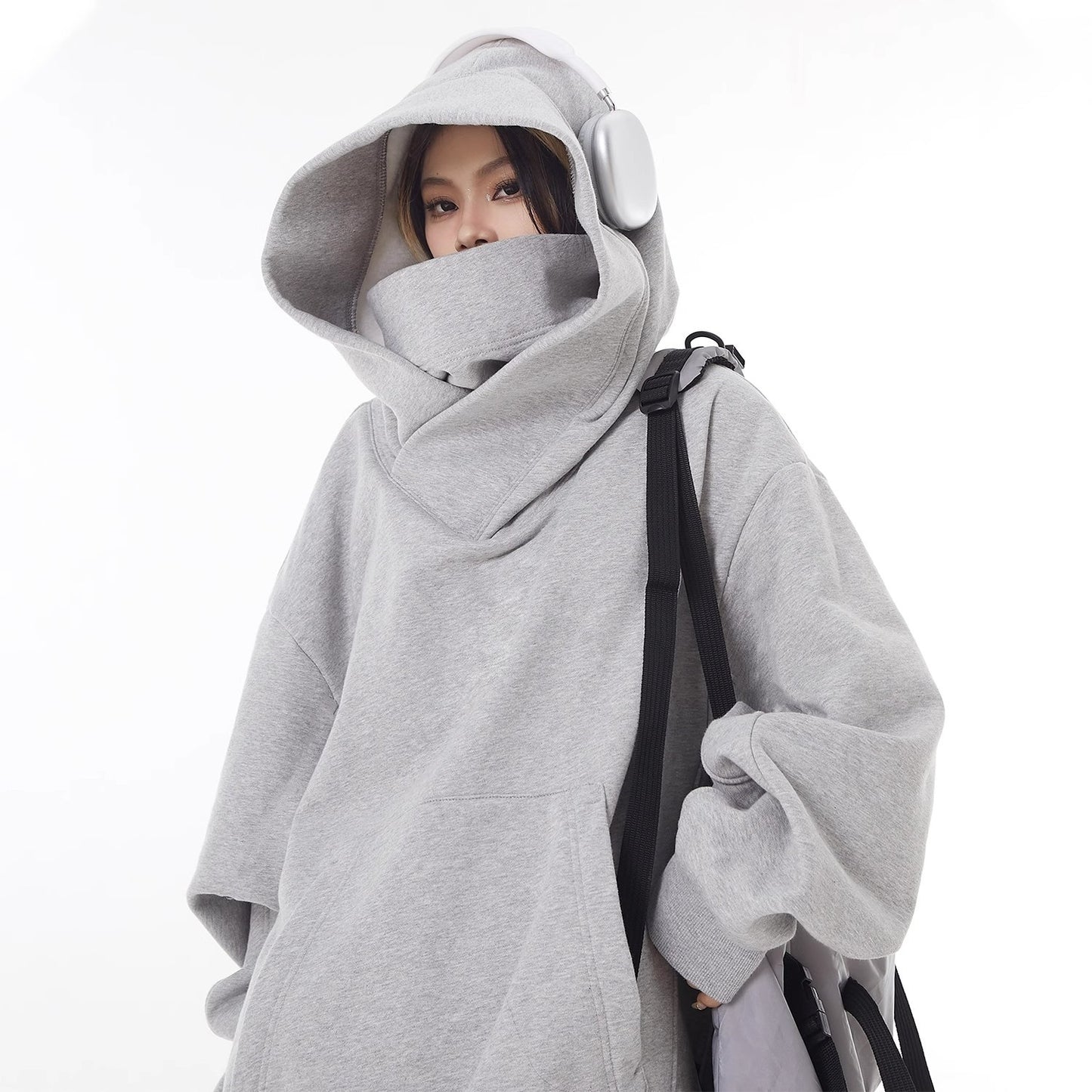 Light gray oversized hoodie with high collar hood and fleece-lined front pocket
