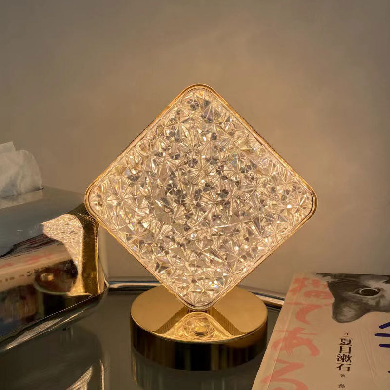 Diamond-shaped acrylic night lamp with star-like LED pattern on round base