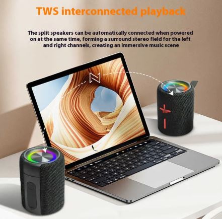 Split black portable speaker pair, shown magnetically connected, textured fabric with red marks