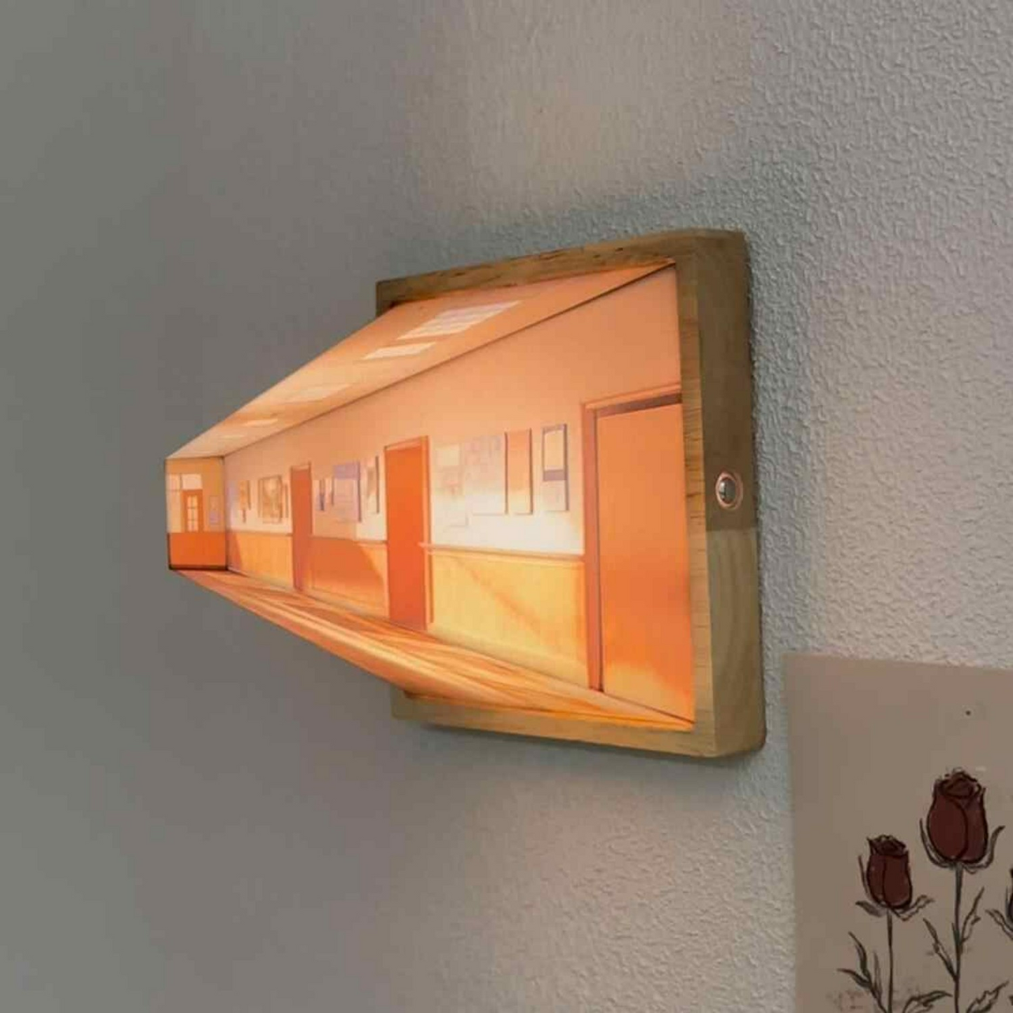 Wooden framed LED night light mounted on textured wall with warm glow