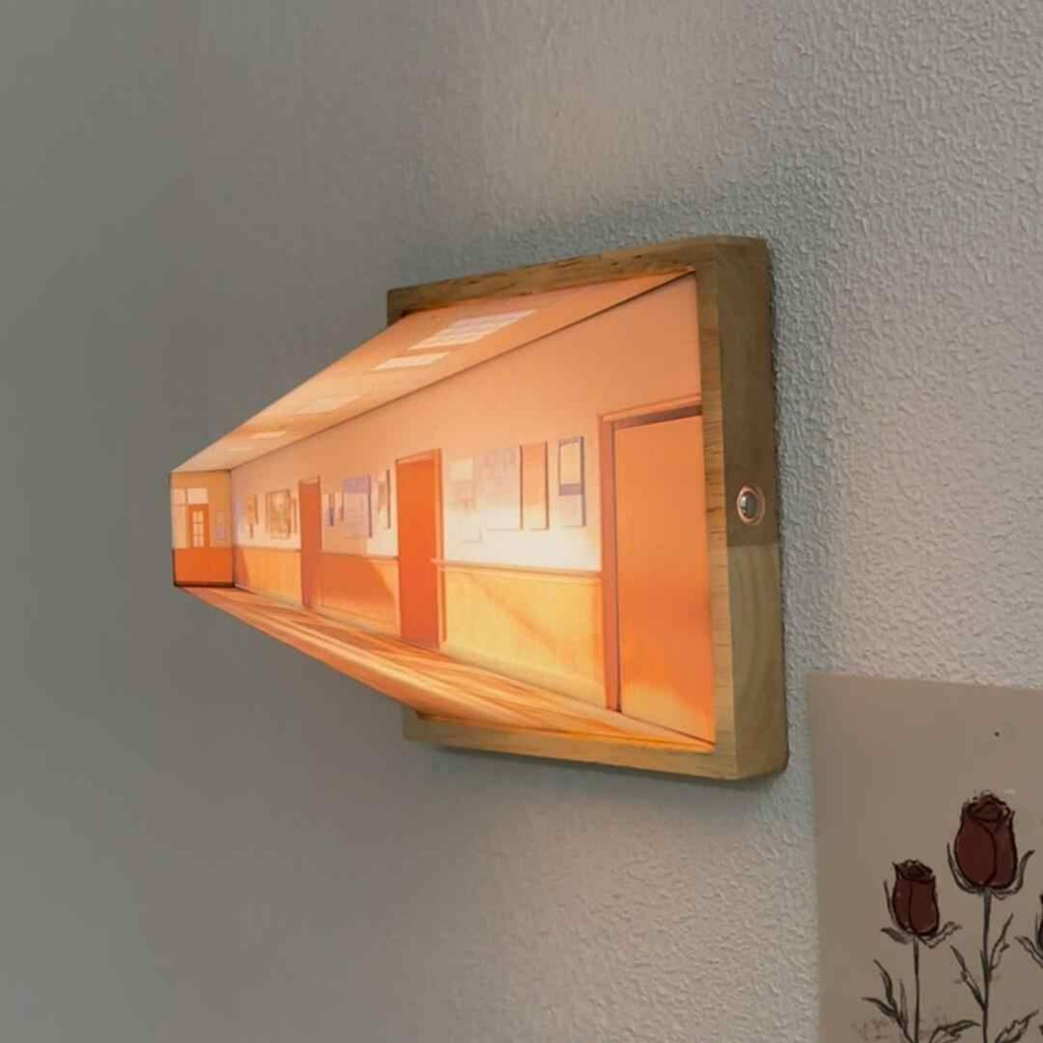 Wooden framed LED night light mounted on textured wall with warm glow