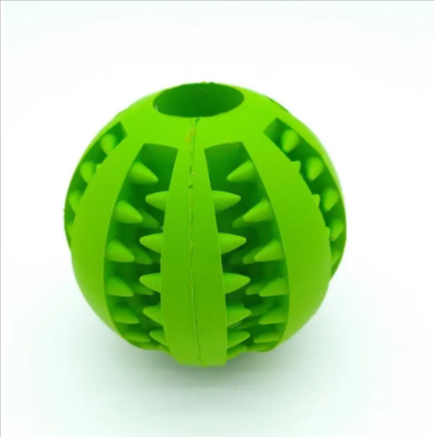 Dog treat dispensing rubber ball in green with raised spikes and center divider