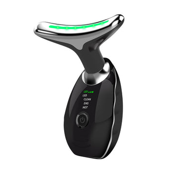 Black microcurrent facial massager with chrome roller head and green LED strip