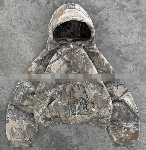 Camouflage zip-up hoodie with hood, visible front zipper and kangaroo pocket