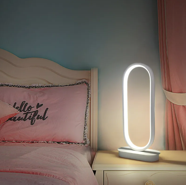 LED oval table lamp with warm glow, white frame and round base