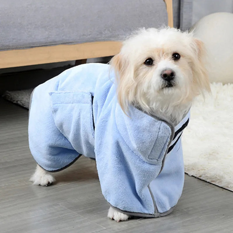 Light blue hooded pet drying bathrobe towel on a small dog, front paws visible