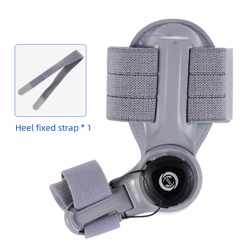 Gray bunion corrector brace with two fabric heel straps and circular adjustment knob