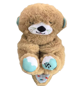 Tan plush bear sleep aid with closed eyes, blue ear accents, musical note belly patch
