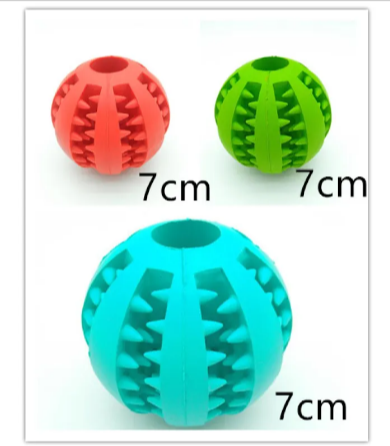 Set of rubber treat-dispensing dog balls in red, green, and blue with spiked ridges