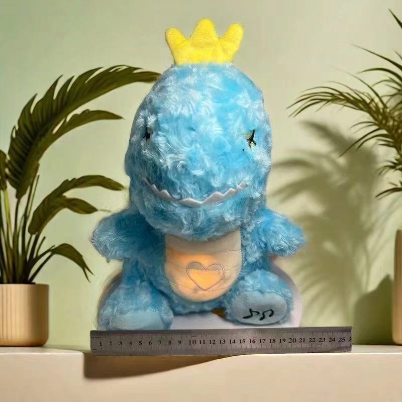 Blue unicorn plush music toy with yellow crown and glowing heart panel