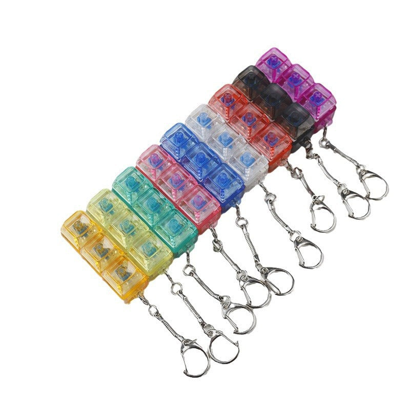 Assorted transparent light-up shaft tester fidget toy keychains in multiple colors
