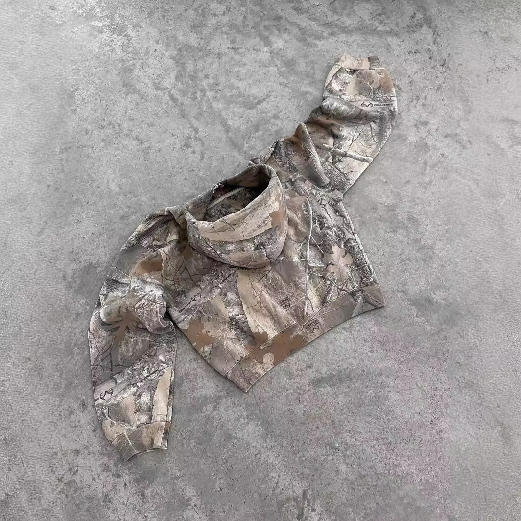 Camouflage oversized hoodie with hood and kangaroo pocket, long sleeves, laid flat
