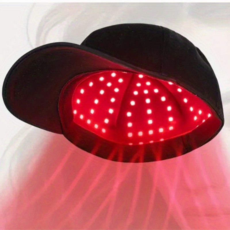Black LED scalp cap with glowing red LED dots and curved brim.