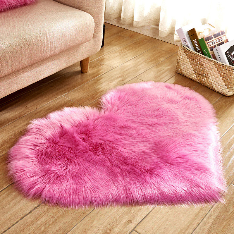 Bright pink fluffy heart rug with darker inner heart panel and long-pile pile.