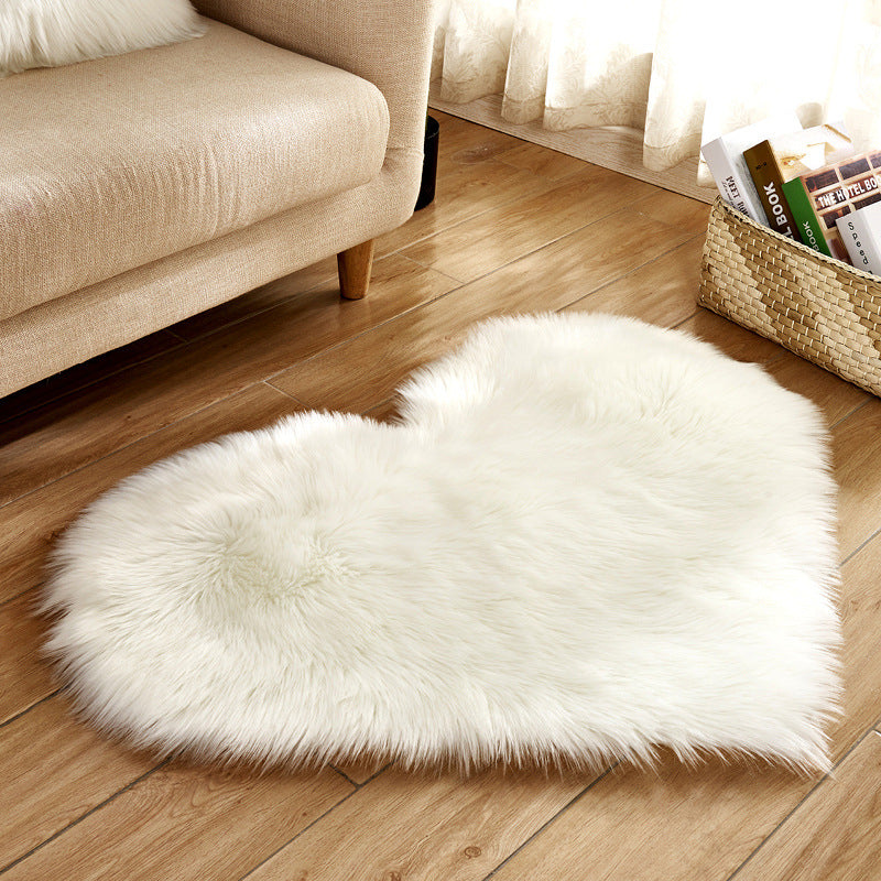 White heart-shaped plush rug with long shag pile, soft fluffy texture
