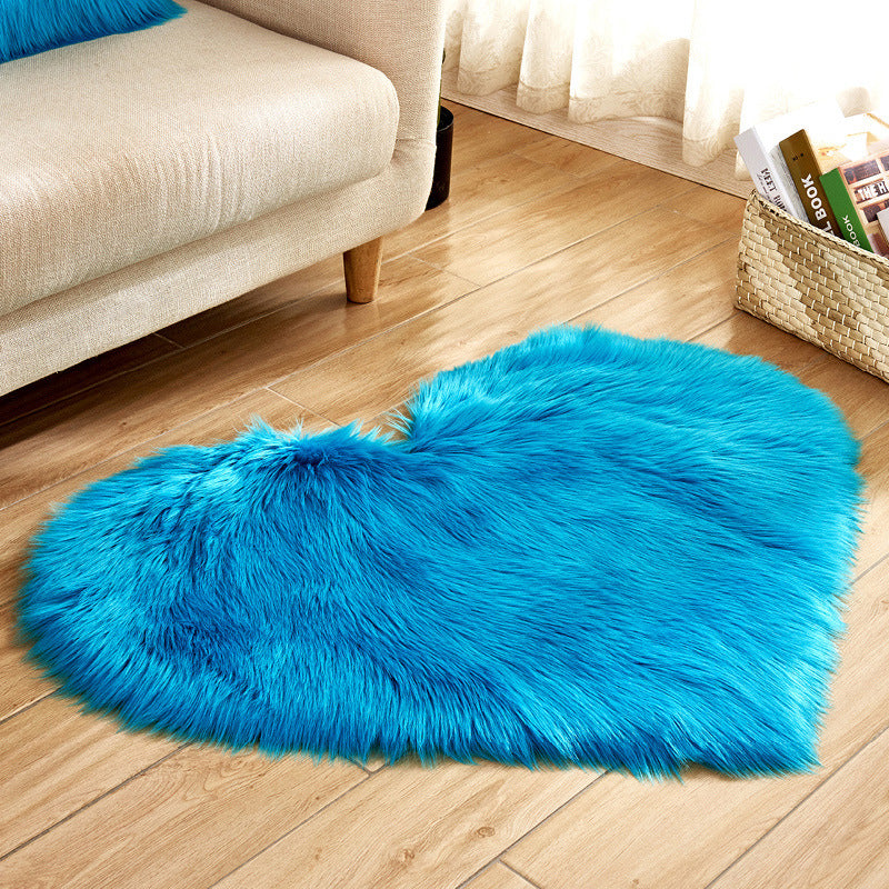 Plush heart-shaped rug in bright blue, long shag pile rug with rounded heart silhouette