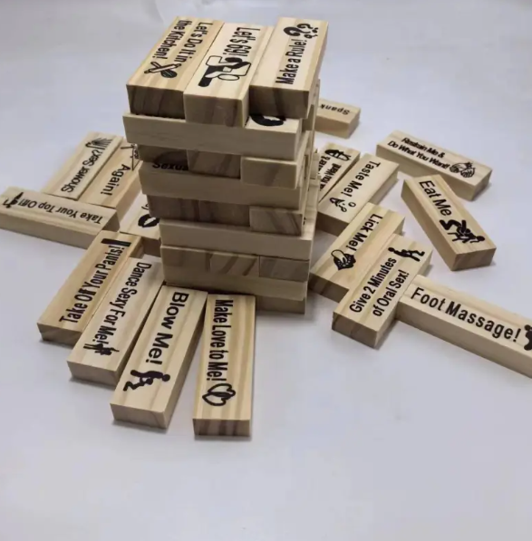 Wooden couples date-night game with stacked Jenga blocks and printed challenge notes