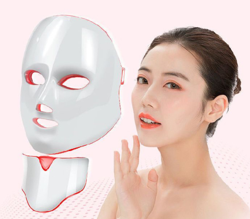 White LED face mask device with red light outlines on face-shape