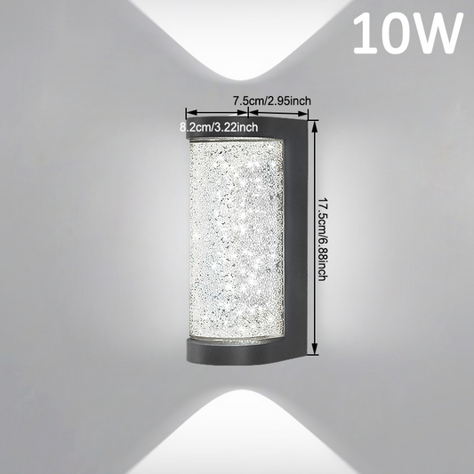 Square LED wall sconce with speckled clear glass cylinder and black frame