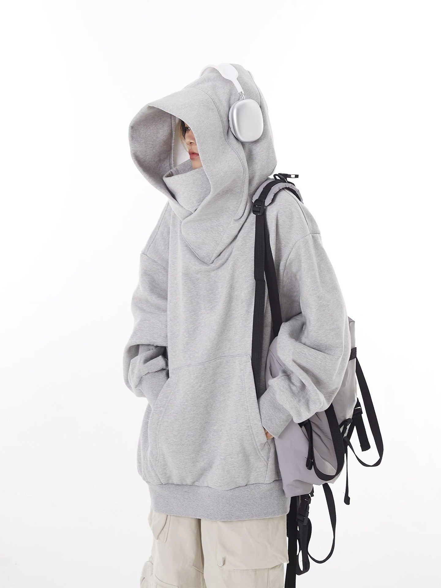 Gray high-collar hoodie with oversized hood, loose fit, and front pouch pocket