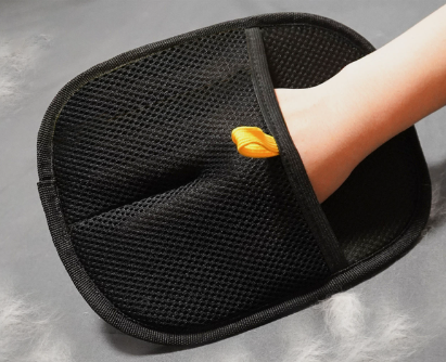 Black pet hair remover glove, textured mesh pad with yellow accent