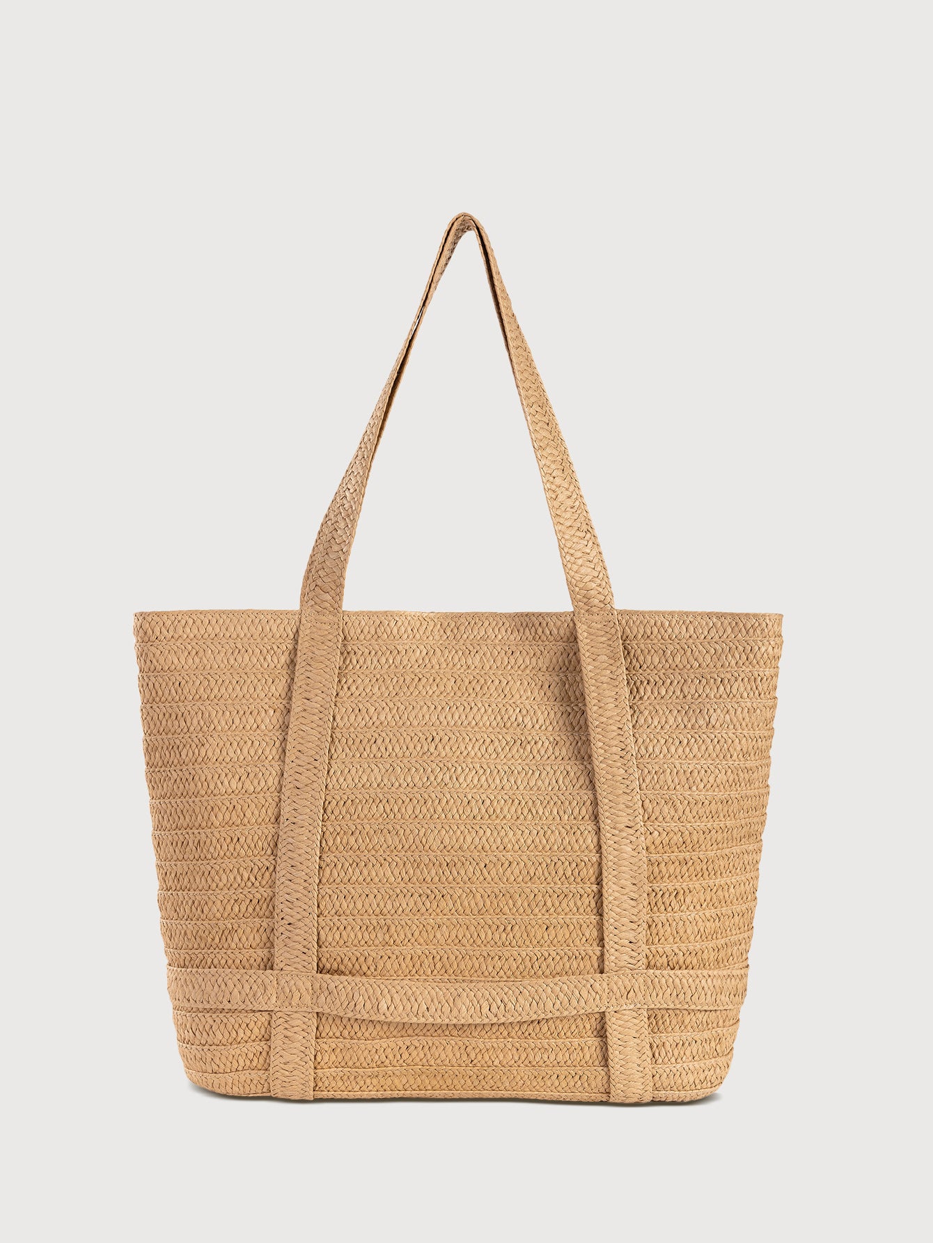 Apricot woven beach tote bag with sturdy handles, open weave texture
