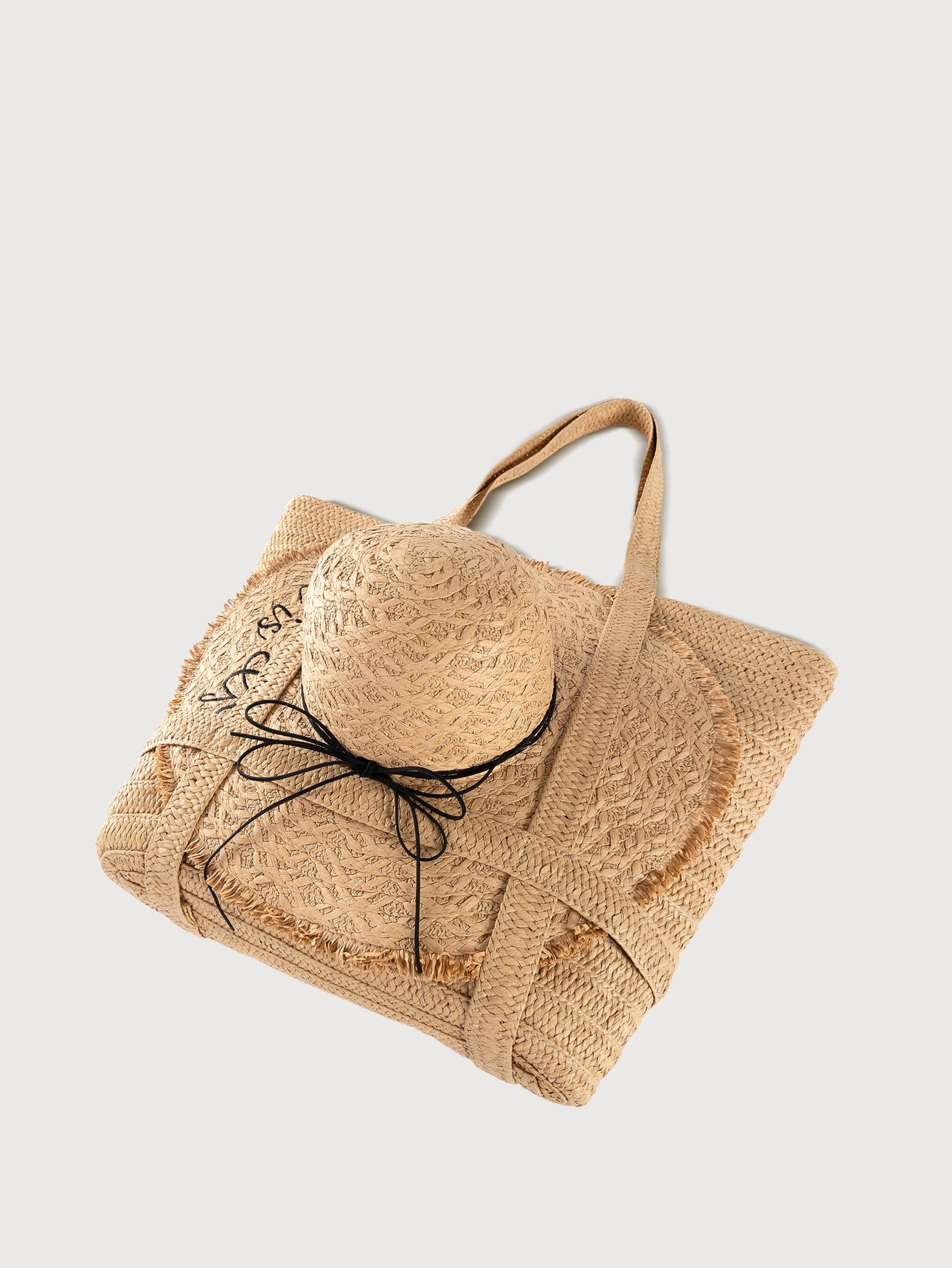 Apricot straw woven tote bag with matching hat, side view