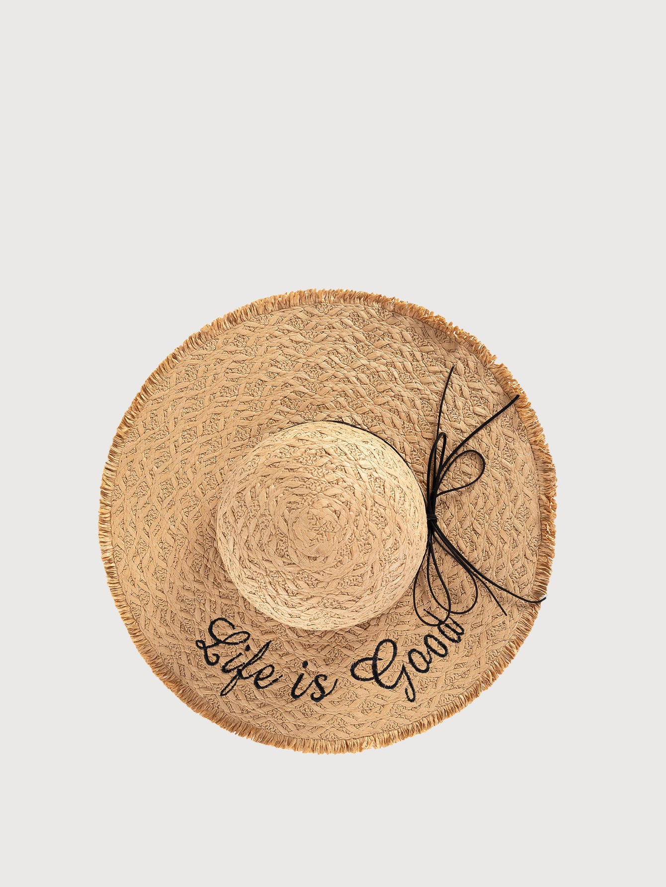 Apricot straw wide-brim hat with decorative black bow and signature text