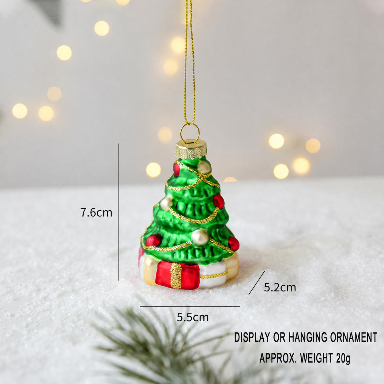 Handmade glass Christmas tree hanging ornament in green with gold topper and red base