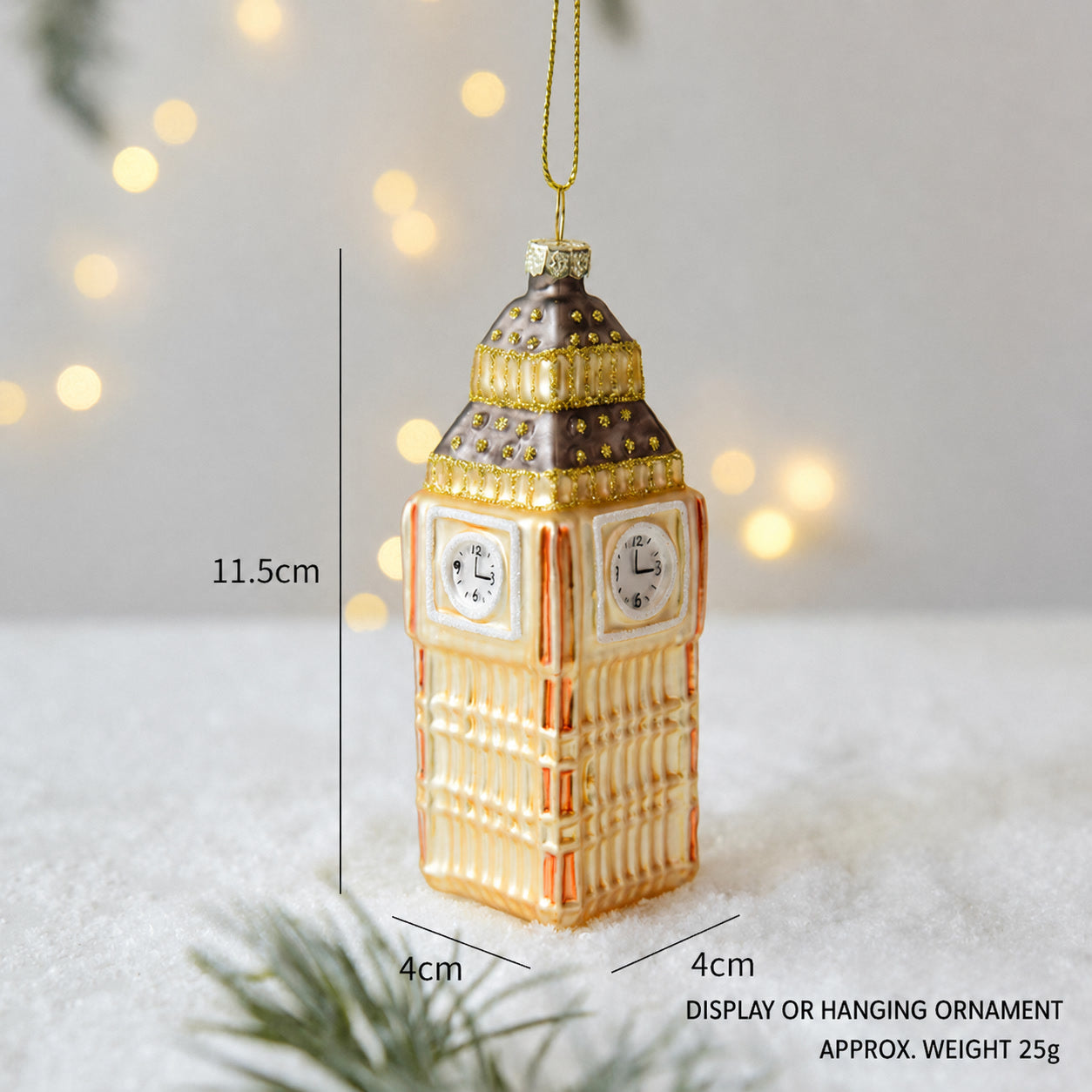 Tall glass tower clock ornament with amber base and gold hanging loop