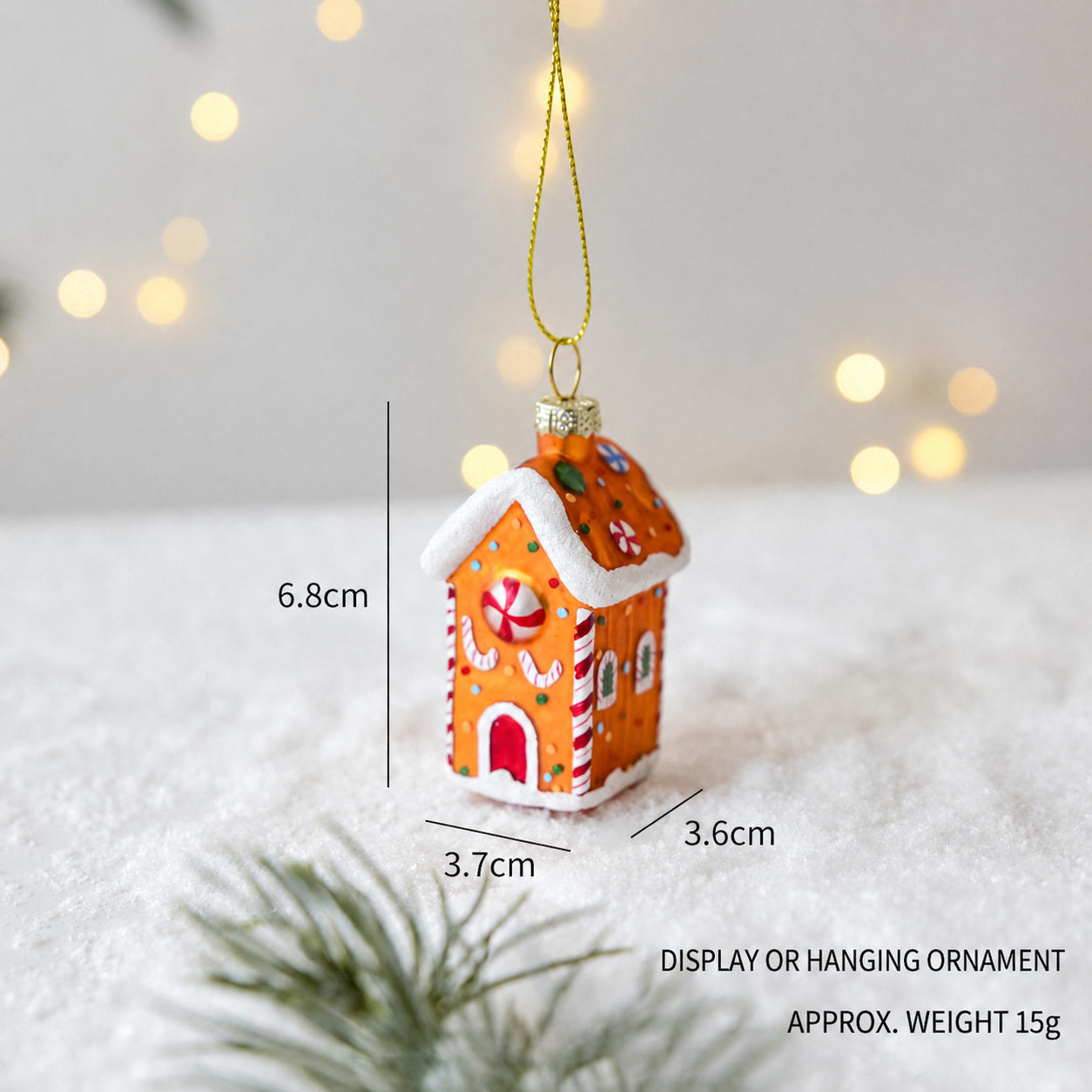 Handmade glass gingerbread house hanging ornament with colorful icing details