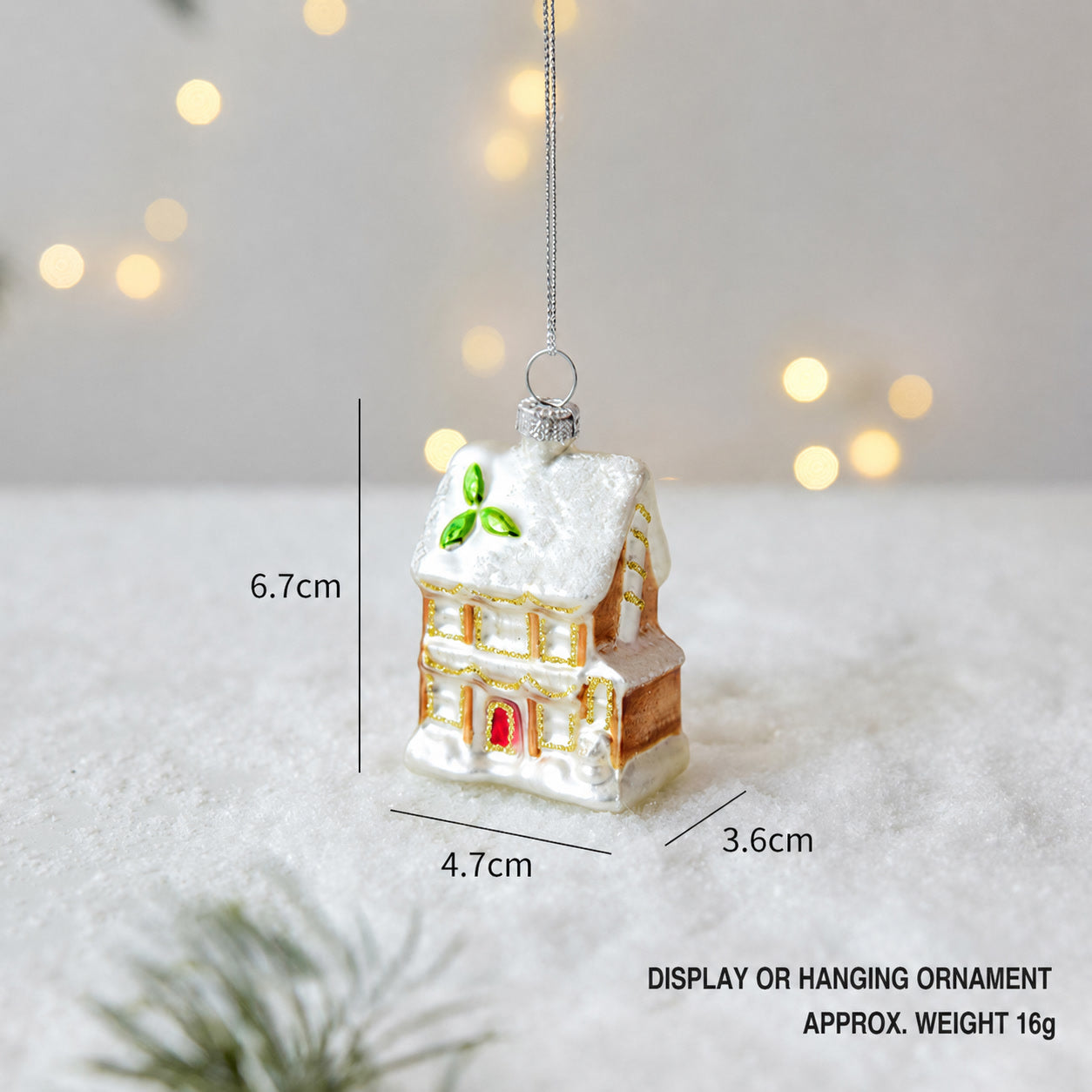 Handmade glass Christmas house hanging ornament with gold trim and green window accents