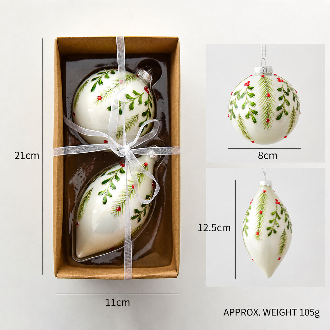 Gift set of white leaf-pattern glass ornaments with green accents and hanging loops