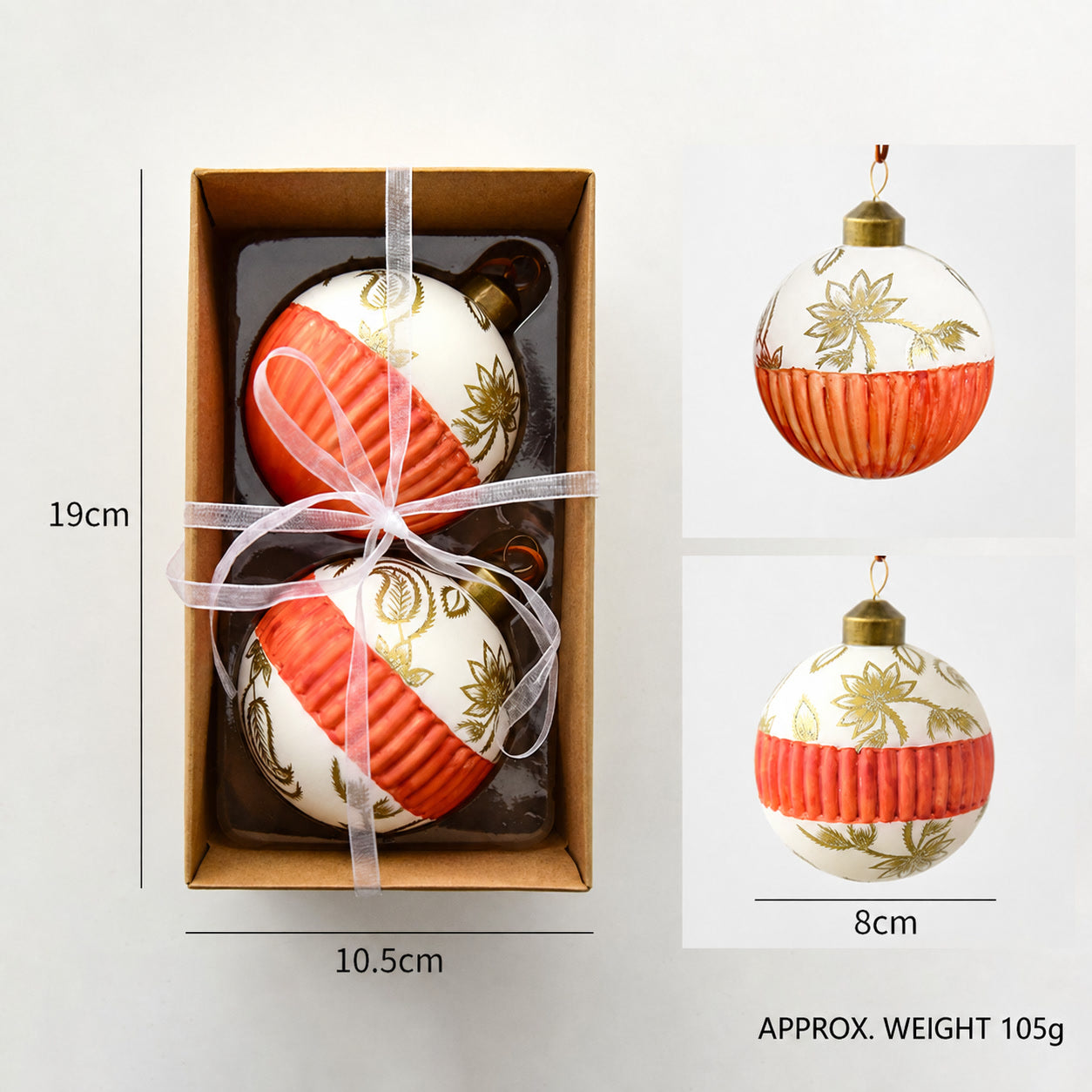 Two orange and white ribbed glass ball ornaments with gold top and hanging loops