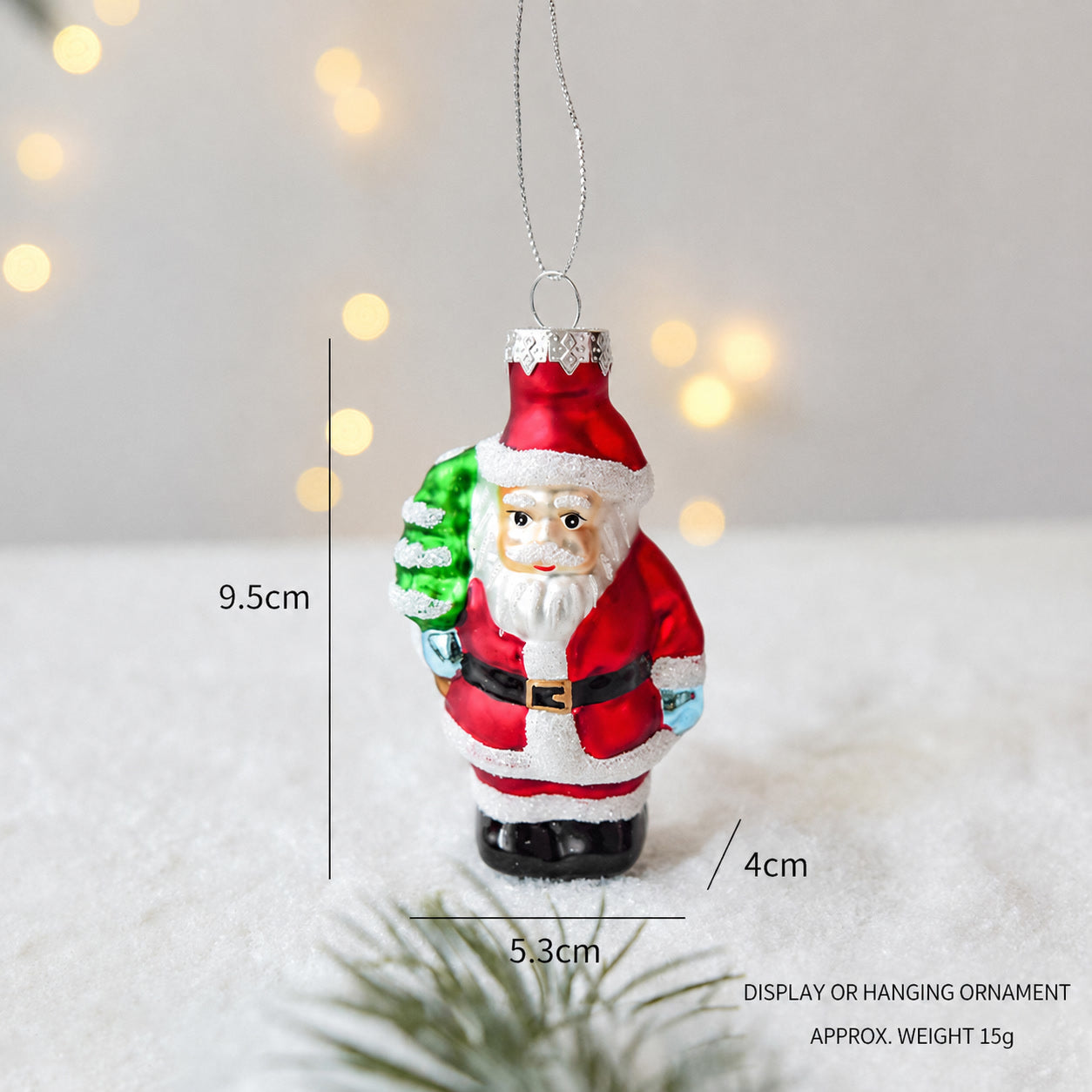 Handmade glass Santa Claus hanging ornament with green tree and red coat
