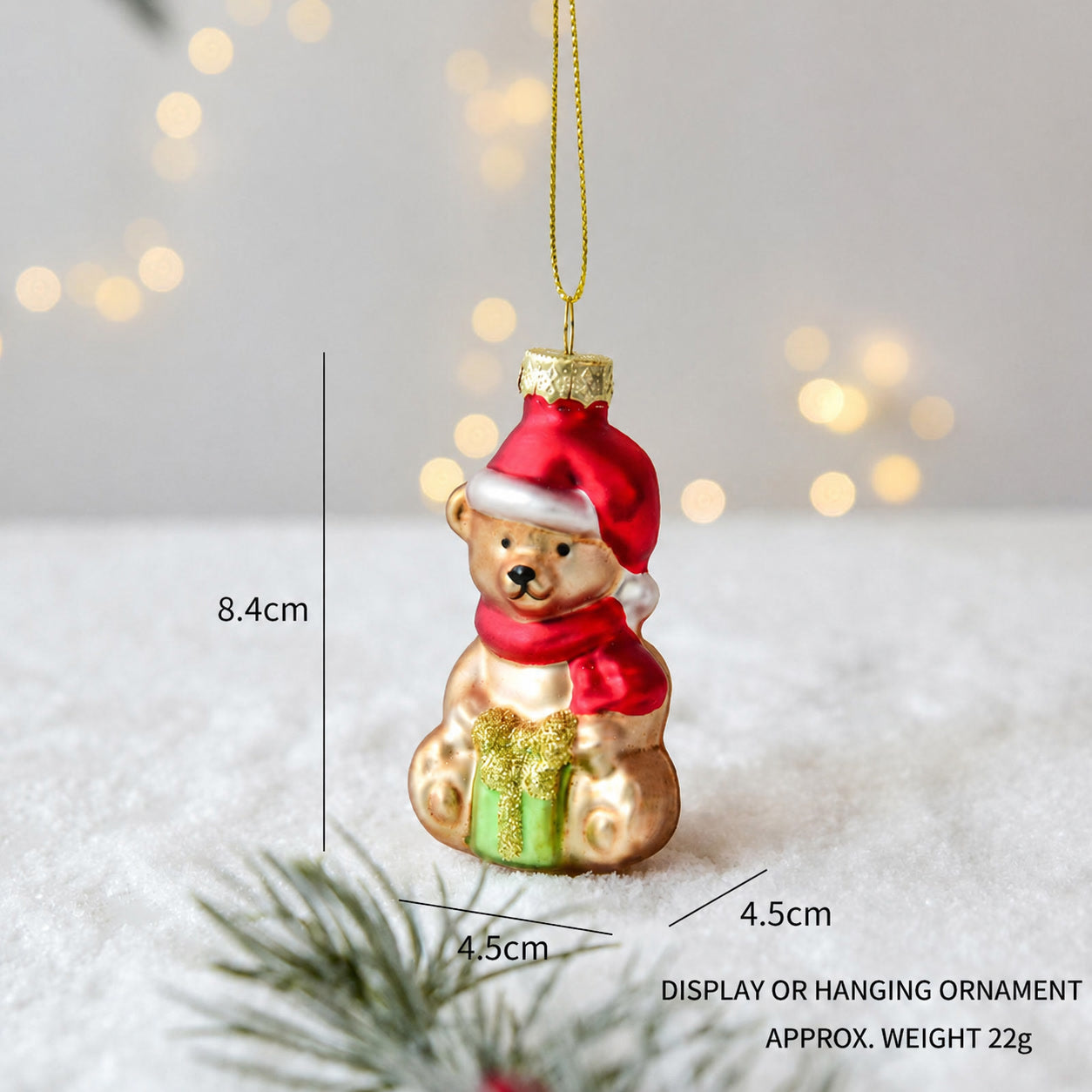 Handmade glass Christmas bear hanging ornament wearing red hat and green gift